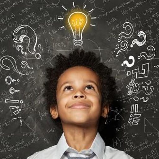 A young boy is looking up at the light bulb.